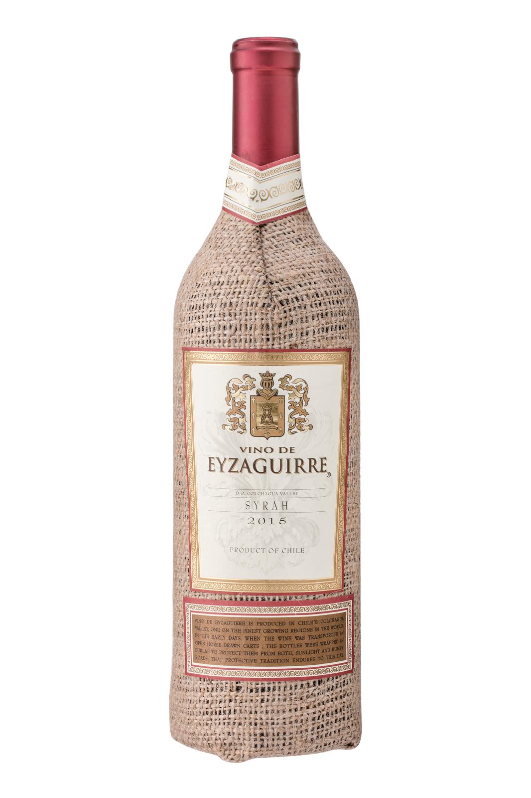 A close-up of a wine bottle with a glass of red wine